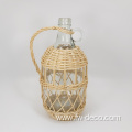 large ratten wrapped clear glass bottles with handle